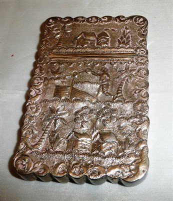 Lot 99 - Late 19th century Indian white metal card case chased with village scenes