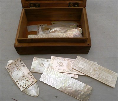 Lot 100 - A collection of Chinese mother-of-pearl gaming counters in an olive wood box