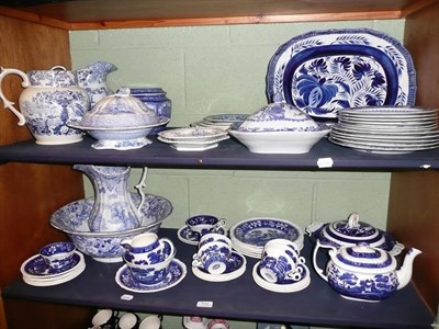 Lot 135 - Spode blue and white plates, blue and white jugs, a meat plate, etc on two trays