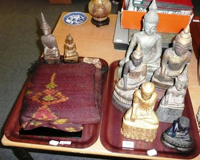 Lot 161 - Seven carved wooden Buddhas and a blue Buddha, a carved jade type frog, a lacquered panel and a...