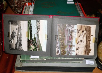 Lot 164 - A collection of postcards in four albums and a shoe box