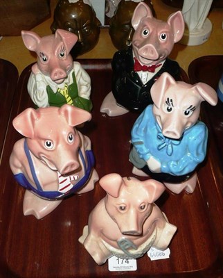 Lot 174 - A set of five Wade Nat West piggy banks