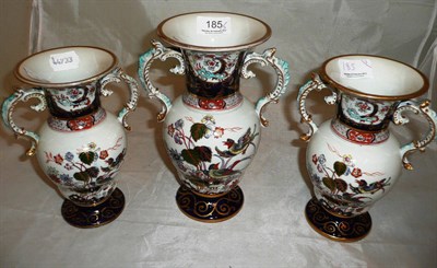 Lot 185 - A 19th century three piece garniture of vases