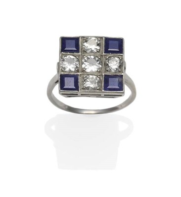 Lot 275 - An Art Deco Diamond and Sapphire Cluster Ring, five old cut diamonds and four step cut...