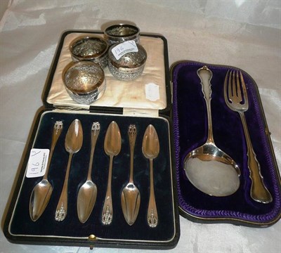 Lot 196 - A cased silver serving spoon and fork, four Indian white metal bowls and a set of six silver...