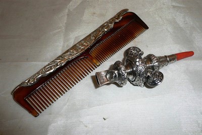 Lot 206 - A child's silver rattle and silver comb