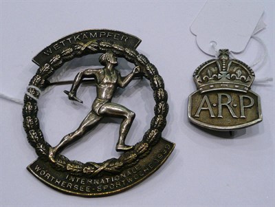 Lot 209 - A German white metal Wettkampfer Internationale Worthersee Sportwoche 1939 badge and a silver...