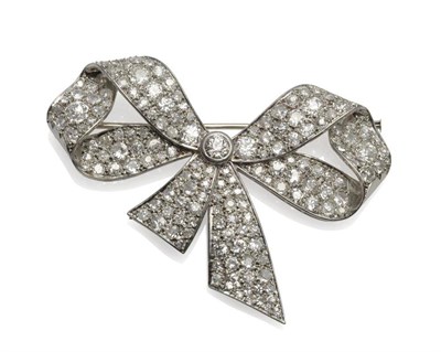 Lot 281 - A Bow Brooch, set with old cut diamonds in a white pavé setting with a rubover set central...