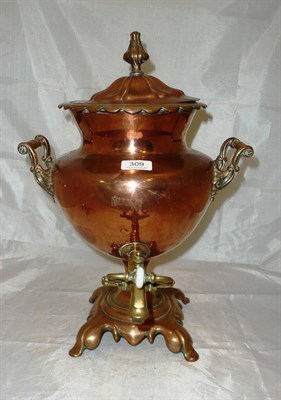 Lot 309 - A 19th century copper and brass tea urn