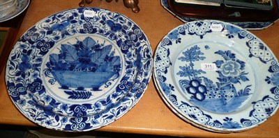 Lot 311 - Three blue and white Delft chargers decorated with flowers