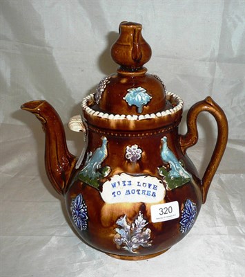 Lot 320 - A bargeware measham teapot with teapot finial, inscribed 'With love to mother'