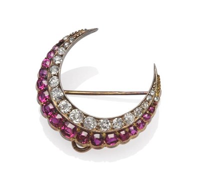 Lot 288 - A Ruby and Diamond Crescent Brooch, a row of old cut and rose cut diamonds to the inner curve...