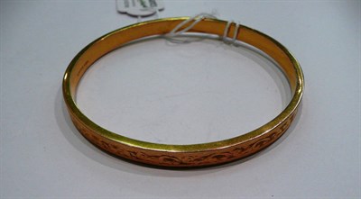 Lot 332 - A 9ct gold slave bangle