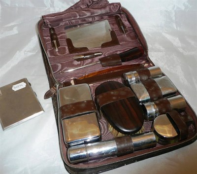 Lot 338 - A silver cigarette case and a gentleman's travelling dressing set