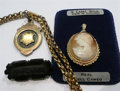 Lot 340 - A silver shield, a jet brooch, a cameo brooch and a necklace