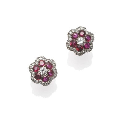 Lot 293 - A Pair of 18 Carat Gold Ruby and Diamond Cluster Stud Earrings, a round brilliant cut diamond...