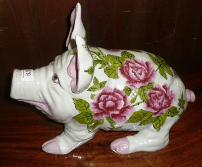 Lot 379 - A porcelain pig painted with roses