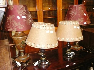 Lot 381 - A pair of Toleware lights with mulberry shades, a pair of barley twist lamps and a decoupage...