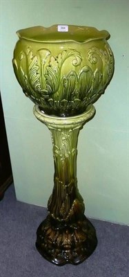 Lot 384 - Green glazed planter on stand