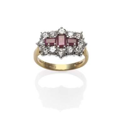 Lot 296 - An 18 Carat Gold Ruby and Diamond Cluster Ring, three baguette cut rubies within a border of...