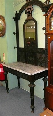 Lot 447 - Large carved oak hall stand with mirror back and marble top