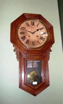 Lot 450 - An Ansonia oak drop dial wall clock with painted dial and Roman numerals