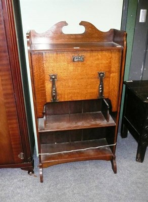 Lot 451 - An Arts & Crafts oak bureau bookcase with stylised tulip motif hinges