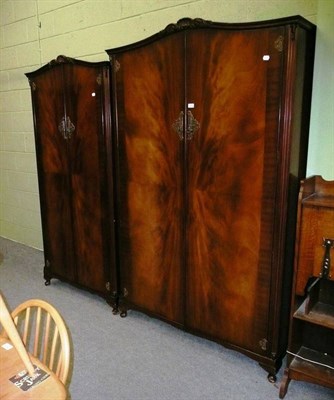 Lot 452 - N Norman Ltd of London, ladies and gents mahogany double door wardrobes (2)