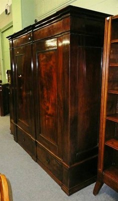 Lot 455 - A large Continental mahogany two door wardrobe