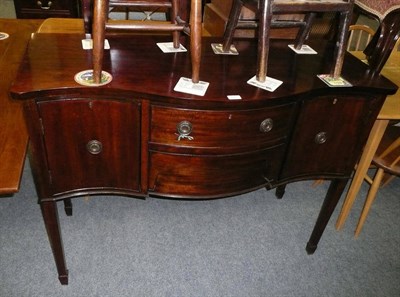 Lot 476 - A reproduction mahogany Serpentine-front sideboard