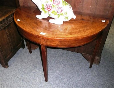 Lot 495 - A 19th century mahogany demi-lune side table