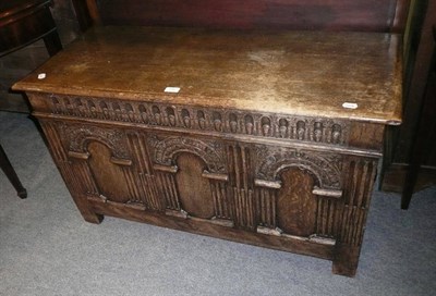 Lot 496 - An early 20th century carved oak coffer