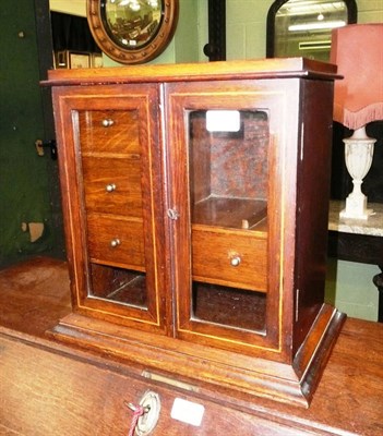 Lot 503 - An inlaid oak smoker's cabinet