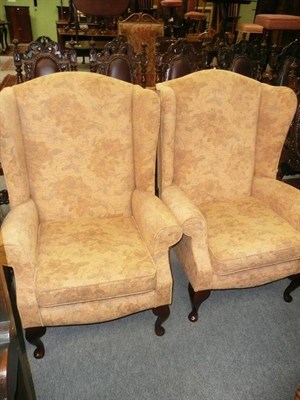 Lot 505 - Pair of modern wing back armchairs