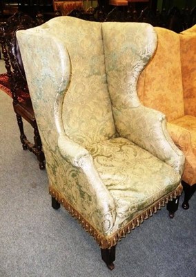 Lot 506 - A 19th century Queen Anne-style upholstered wing armchair