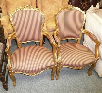 Lot 508 - A pair of gilt elbow chairs