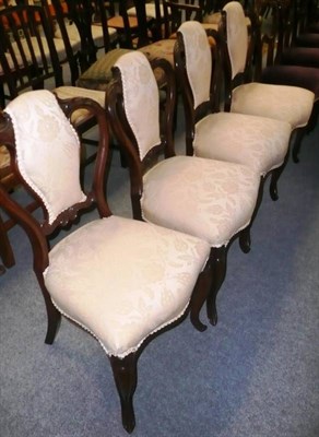 Lot 523 - A set of four Victorian upholstered mahogany chairs