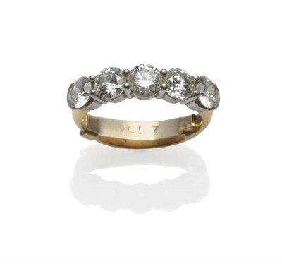 Lot 309 - A Diamond Five Stone Ring, the round brilliant cut diamonds in white claw settings, on a yellow...