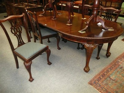 Lot 547 - An early 20th century mahogany extending dining table with six chairs (5+1)