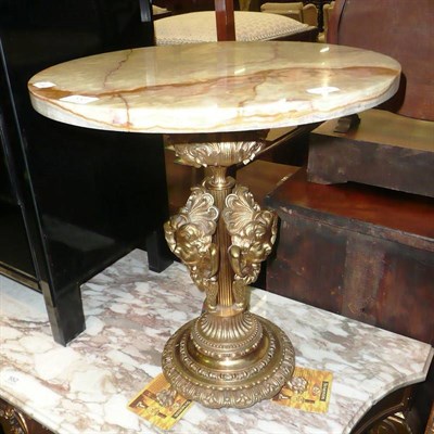 Lot 553 - A gilt metal and onyx table