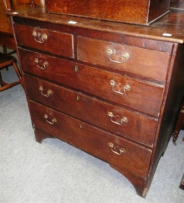 Lot 557 - An oak four height chest of drawers