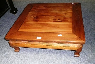 Lot 560 - Chinese low square table in elm and yew