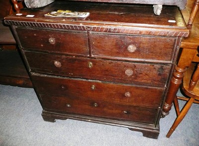 Lot 570 - An oak four height chest of drawers