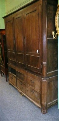 Lot 574 - 19th century oak livery cupboard