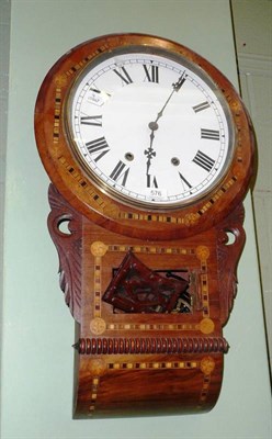 Lot 576 - A walnut inlaid drop dial wall clock