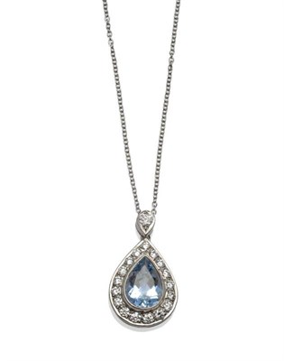 Lot 313 - An Aquamarine and Diamond Cluster Pendant on Chain, a pear cut aquamarine within a border of...