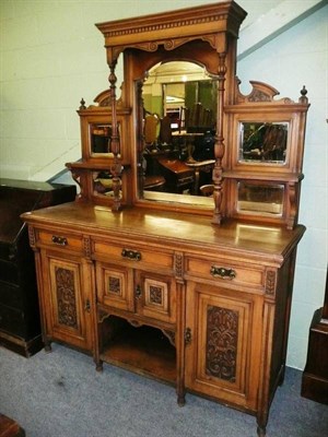 Lot 582 - A Victorian carved walnut sideboard with mirrored gallery back