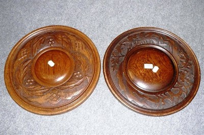 Lot 590 - Two carved oak circular plates/plaques