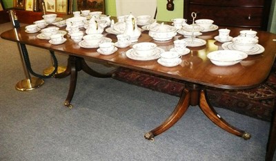 Lot 593 - A reproduction mahogany twin pillar dining table