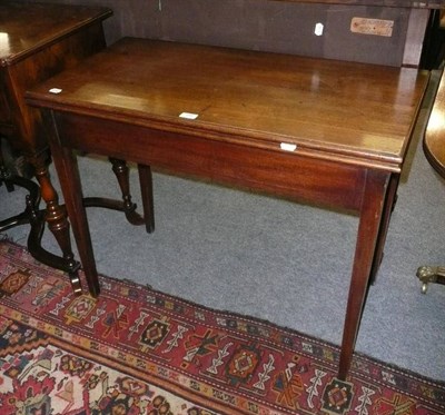 Lot 594 - 19th century mahogany fold over tea table